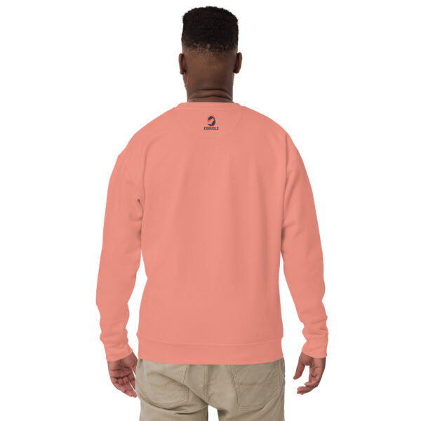 A man wearing an orange sweatshirt with the words " it's not easy being black."