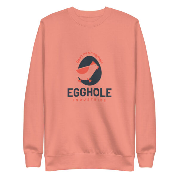 A peach colored sweatshirt with an egghole logo.