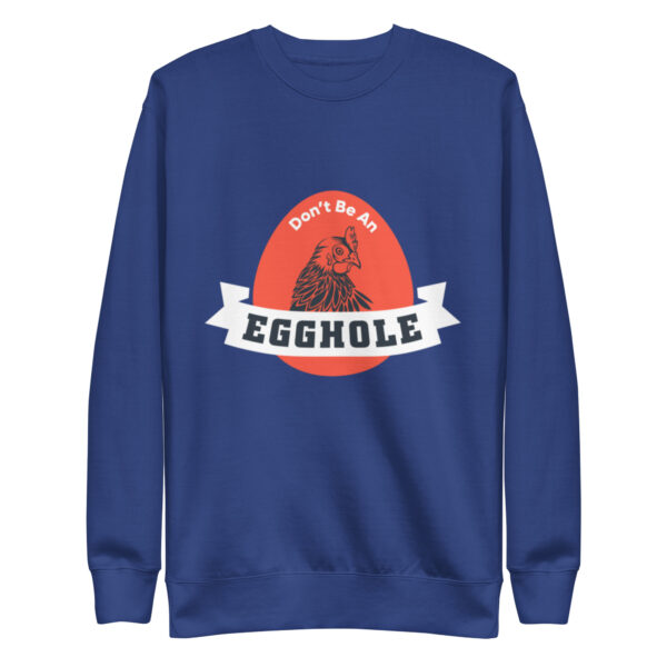 A blue sweatshirt with an egg hole logo on it.