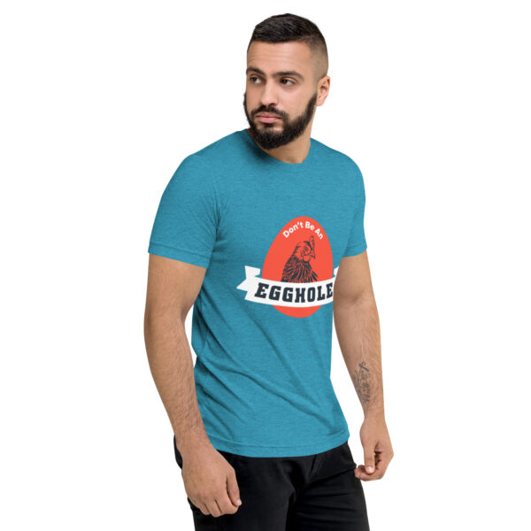 A man wearing a blue t-shirt with the words equuleus on it.