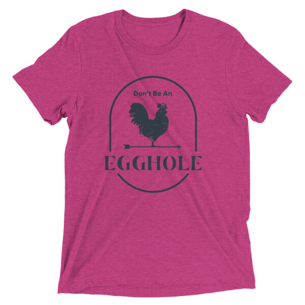 A pink t-shirt with an egg hole logo.