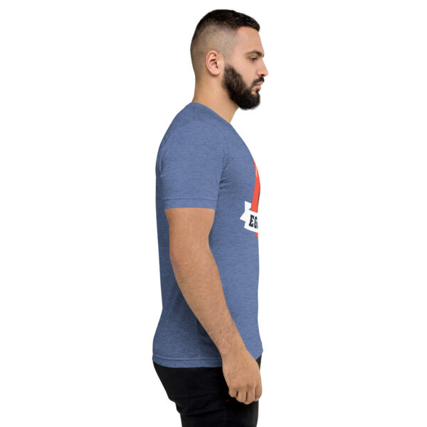 A man with a beard is wearing a blue shirt