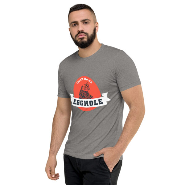 A man wearing a t-shirt with the word " struggle " on it.