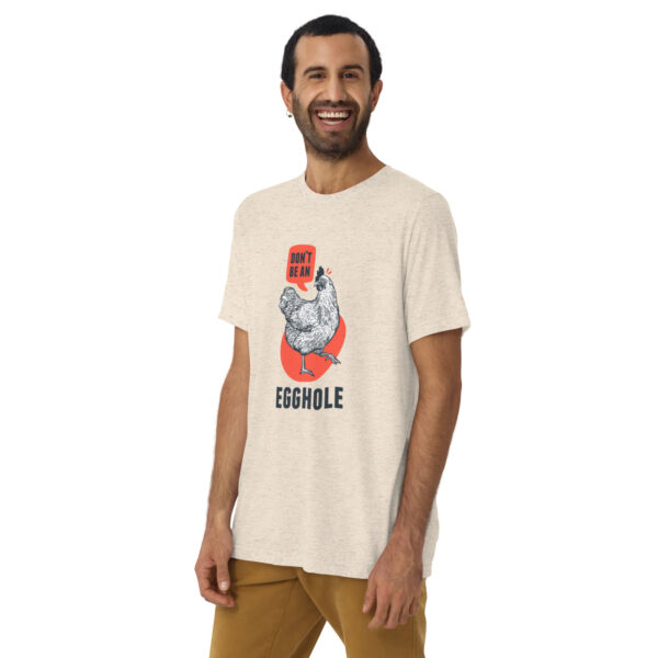 A man wearing a t-shirt with an image of a person holding something.