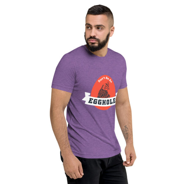 A man wearing purple t-shirt with the word equuleus on it.