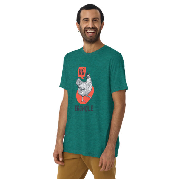 A man wearing a green t-shirt with an image of a cat on it.