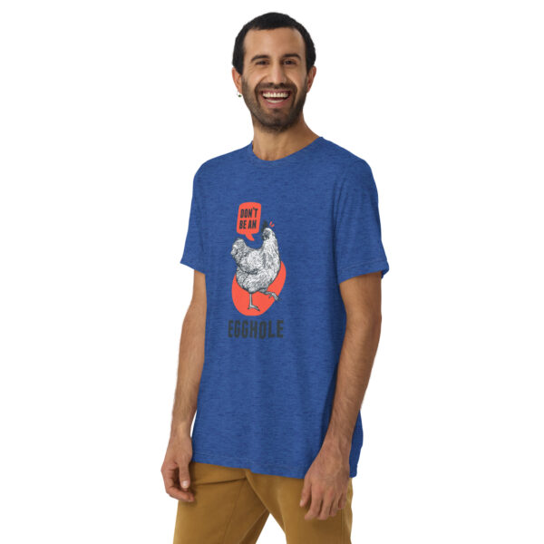 A man wearing a blue t-shirt with an image of a cat on it.