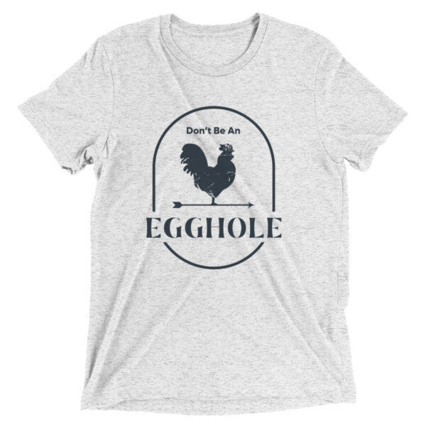 A white t-shirt with an egg hole design on it.