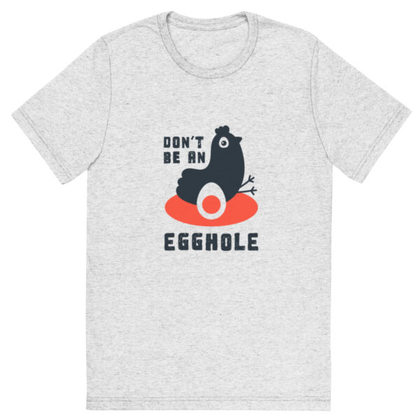 A t-shirt with an image of a black bear on top of an orange and white donut.