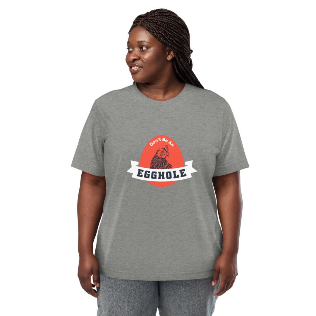 Smiling woman wearing a gray t-shirt with a red sun graphic and the word "BEAMS".