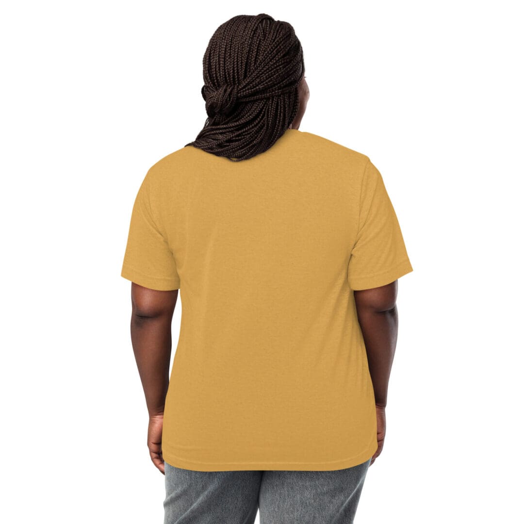 Person wearing a mustard yellow T-shirt and gray pants, viewed from the back.