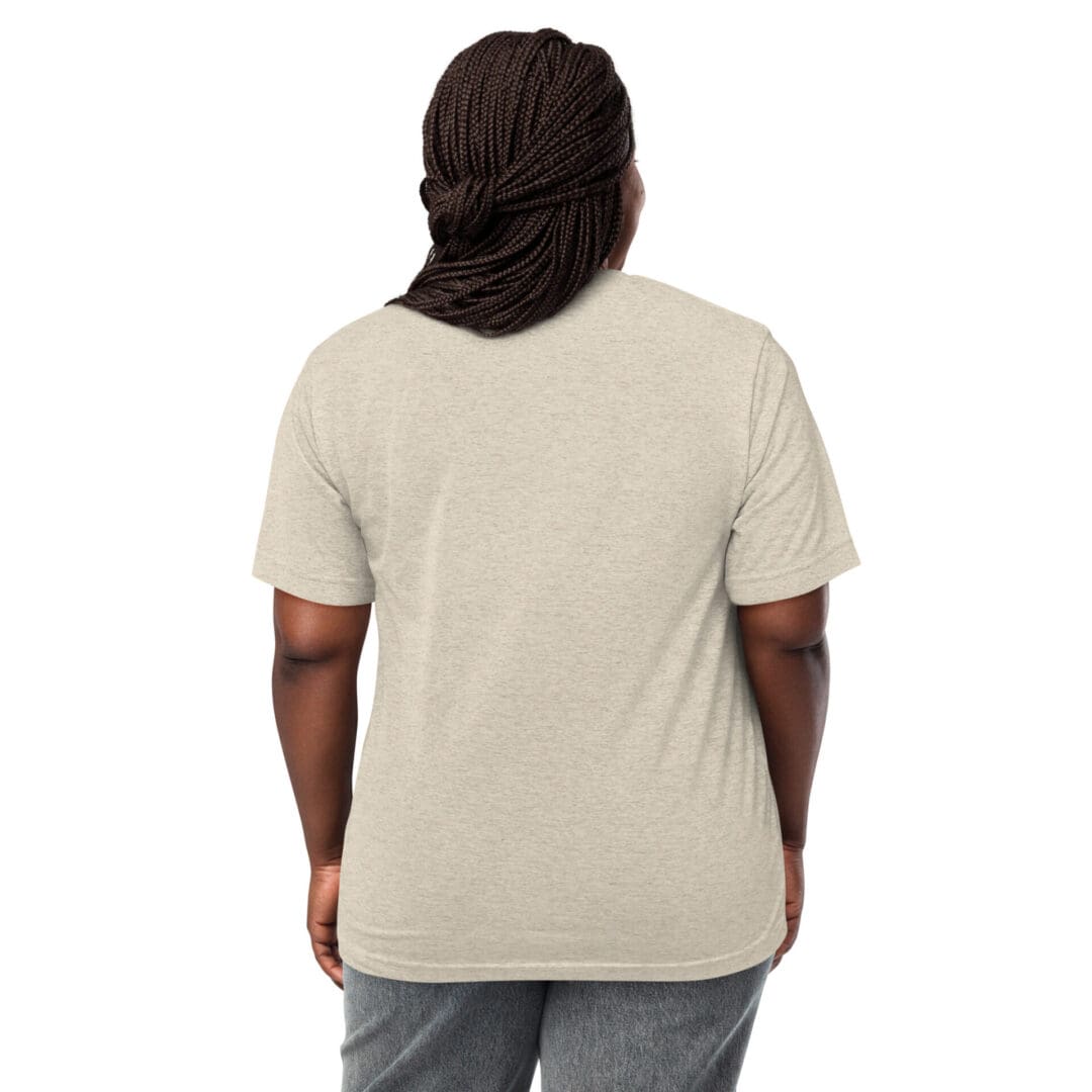 Back view of a person wearing a beige T-shirt and gray pants.