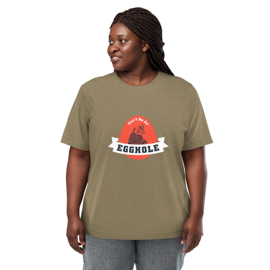 A smiling woman wearing an olive green T-shirt with a colorful graphic.
