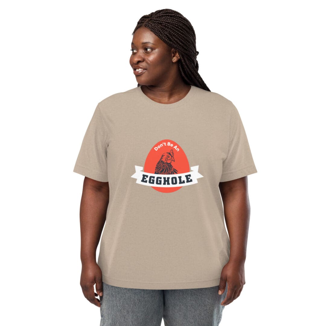 Person wearing a beige T-shirt with a colorful graphic design.