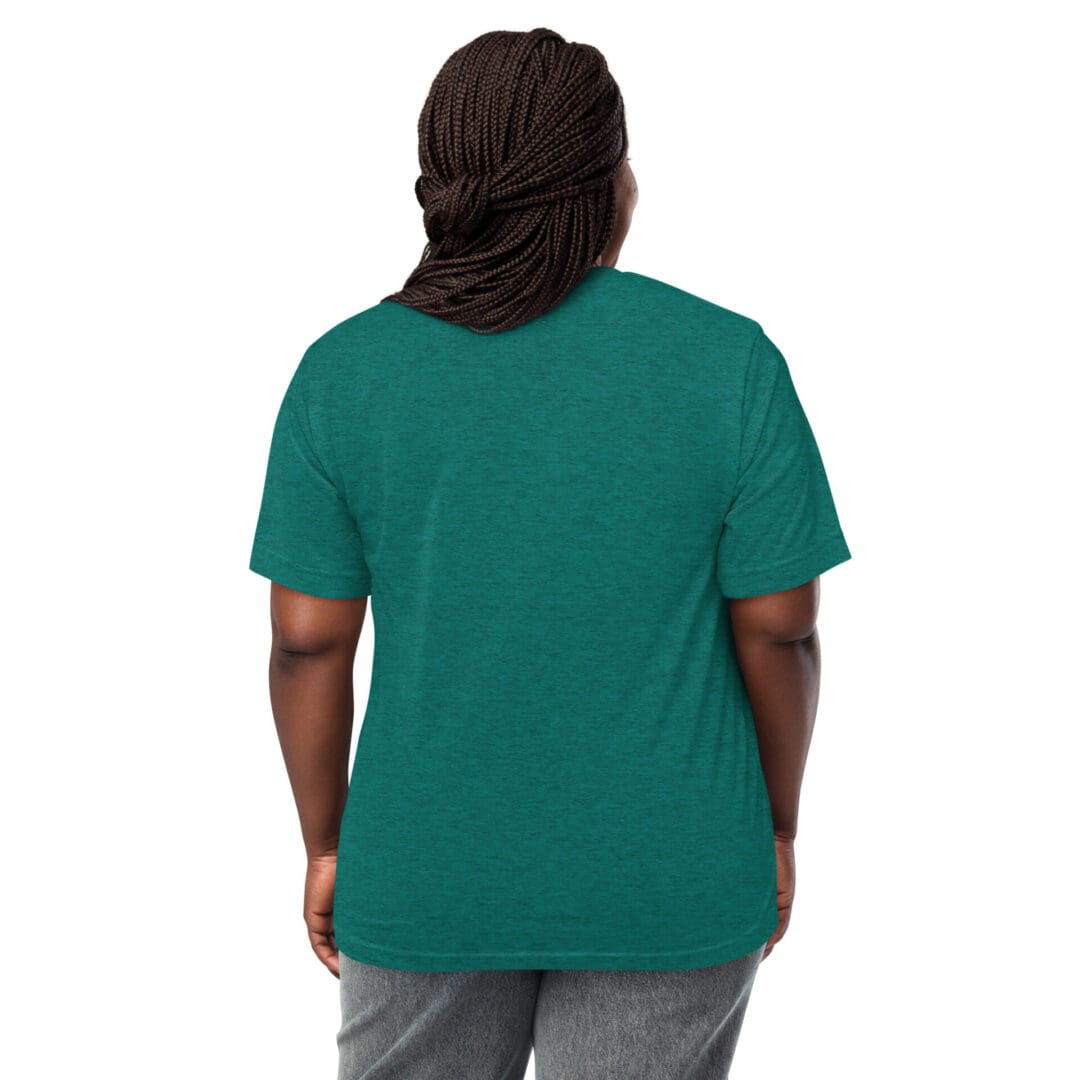 Person wearing a green t-shirt and gray pants, viewed from the back.