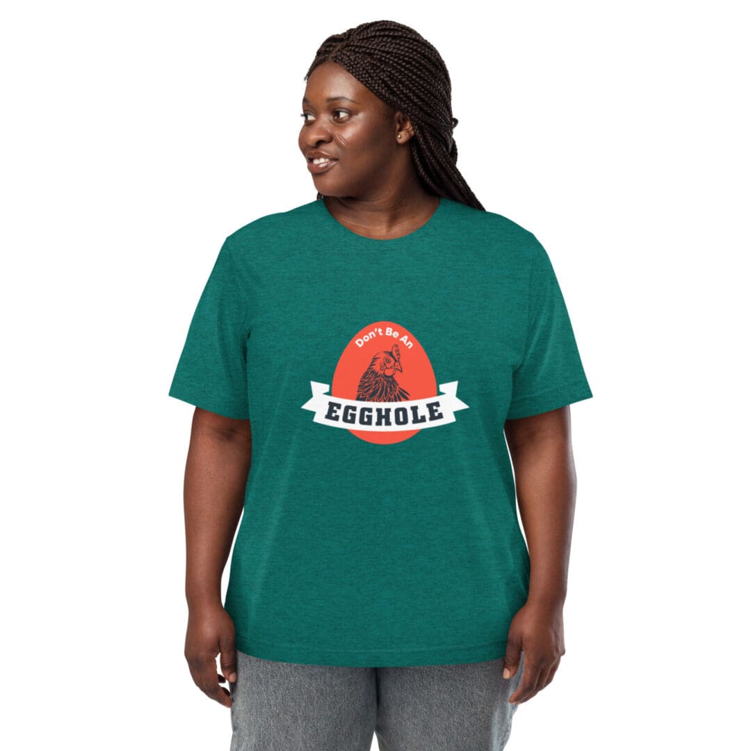 Smiling woman wearing a green t-shirt with a red sun and 'serene' text.